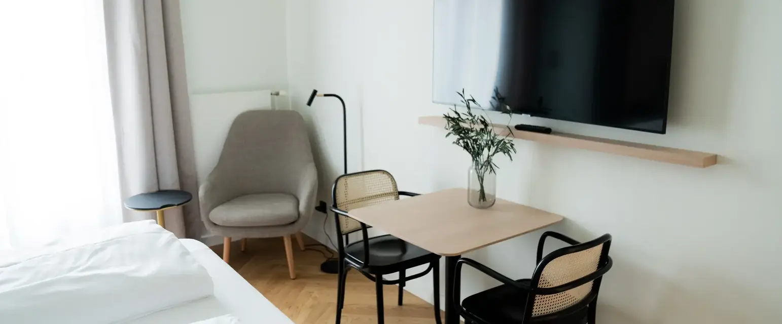 a room with a tv and table