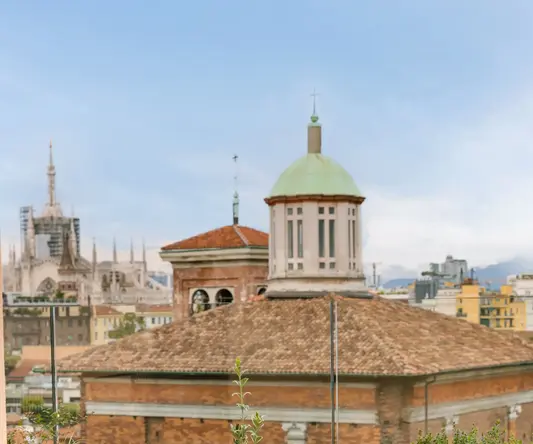 a table and chairs on a rooftop