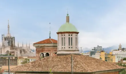a table and chairs on a rooftop
