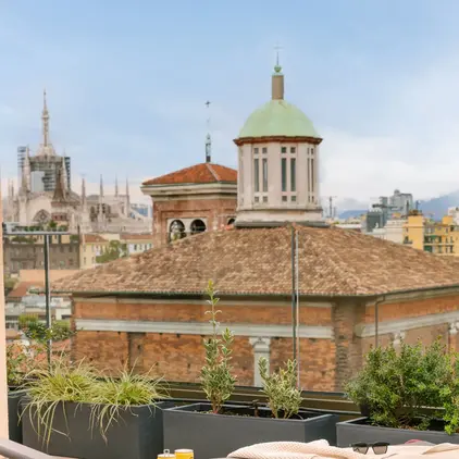 a table and chairs on a rooftop