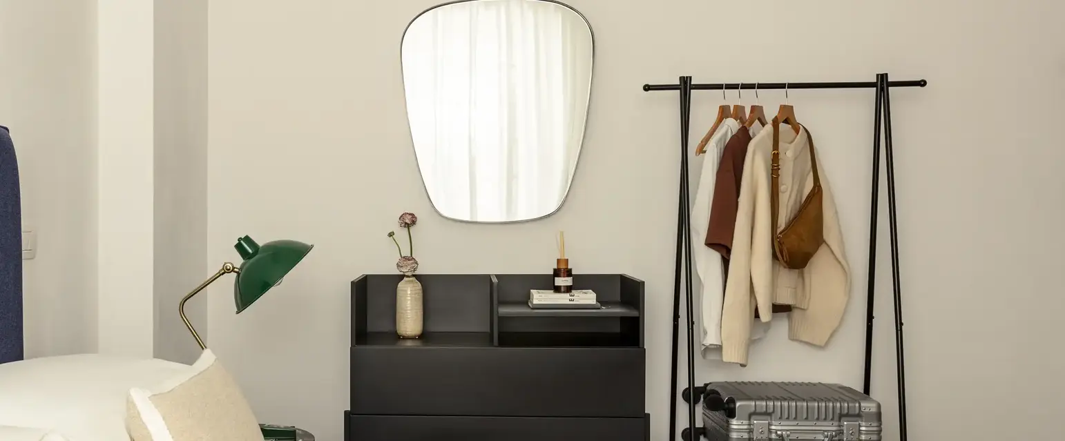 a mirror above a bed