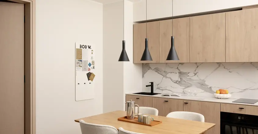 a kitchen with a table and chairs