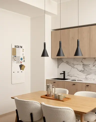 a kitchen with a table and chairs