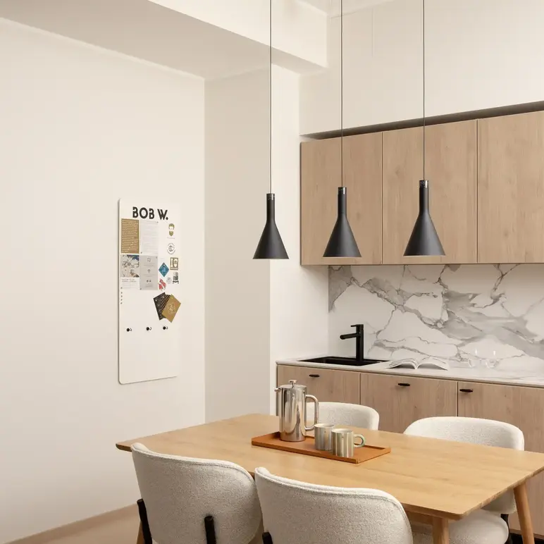 a kitchen with a table and chairs