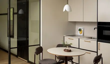 a kitchen with a table and chairs