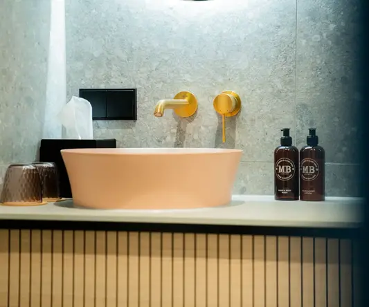 a sink and faucet in a bathroom