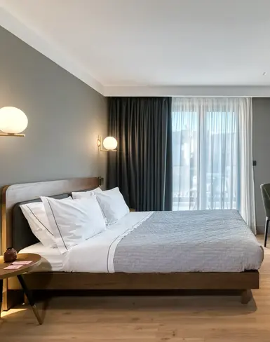 a bedroom with a bed and a tv