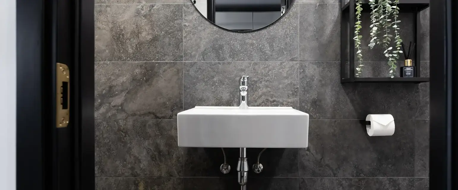 a sink and mirror in a bathroom