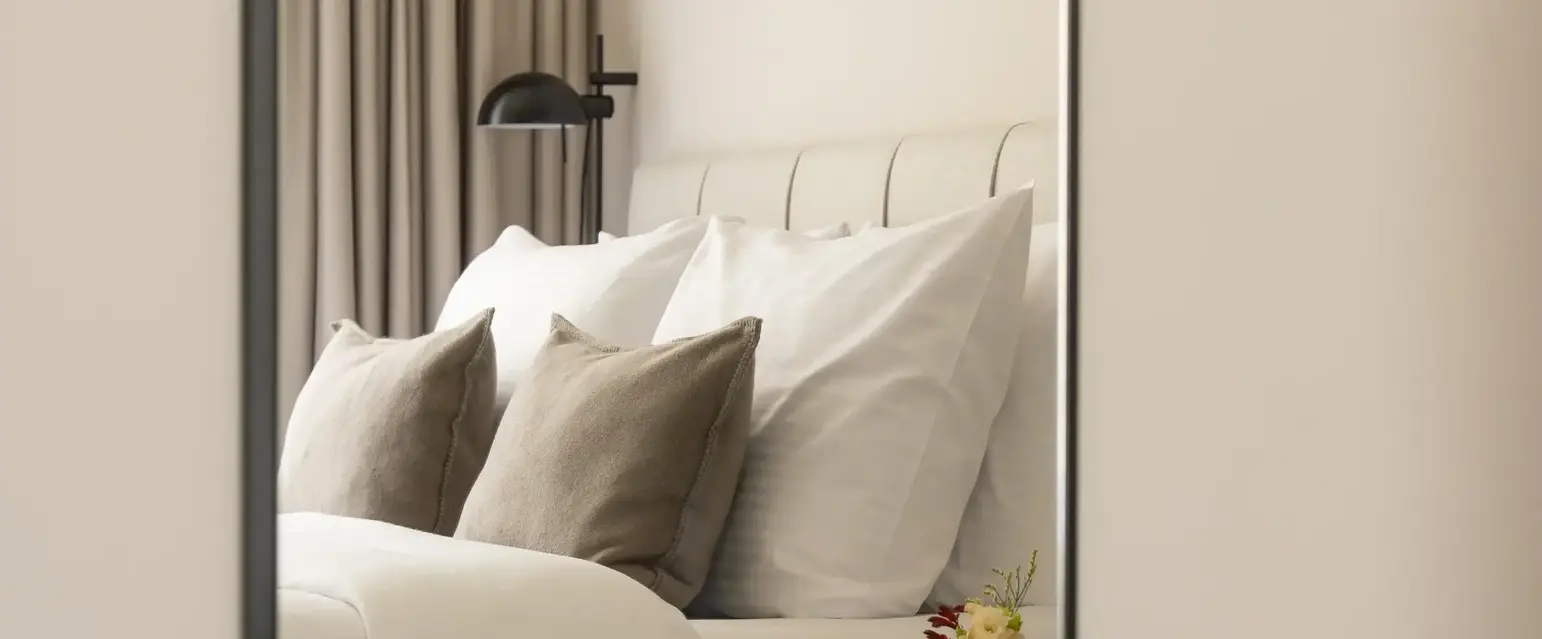 a mirror in a bedroom