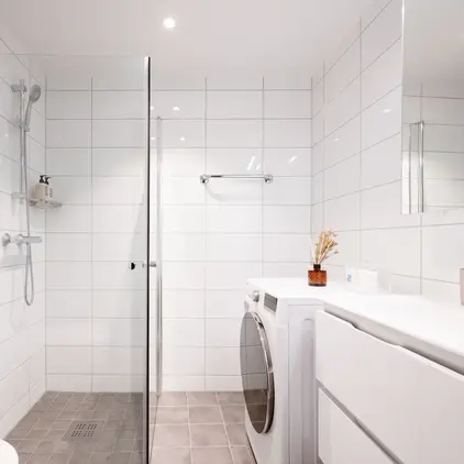 a bathroom with a washer and dryer