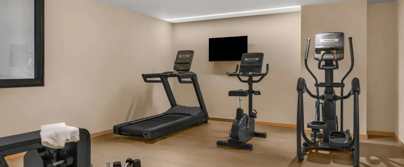 a room with treadmills and exercise equipment