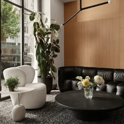 a room with a black couch and a black coffee table