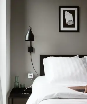 a bed with a laptop on it