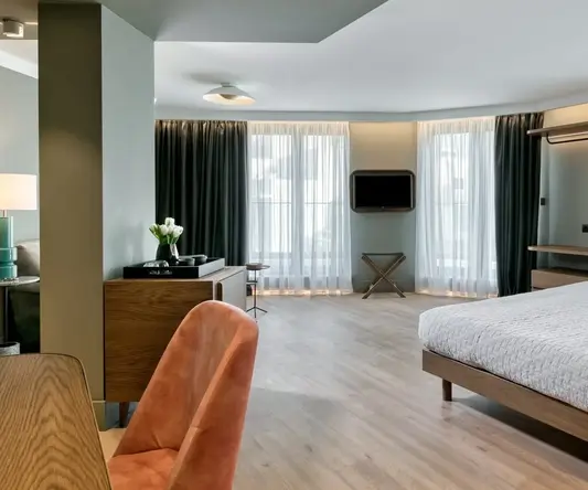 a room with a bed and a mirror