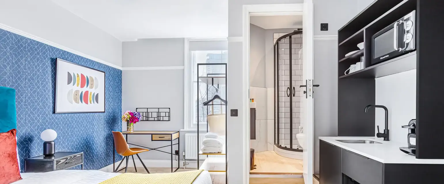 a room with a bed and a sink