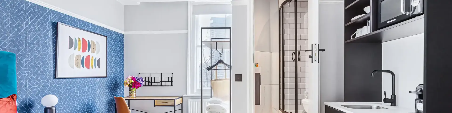 a room with a bed and a sink