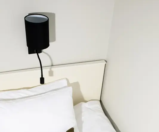 a book and a pillow on a bed