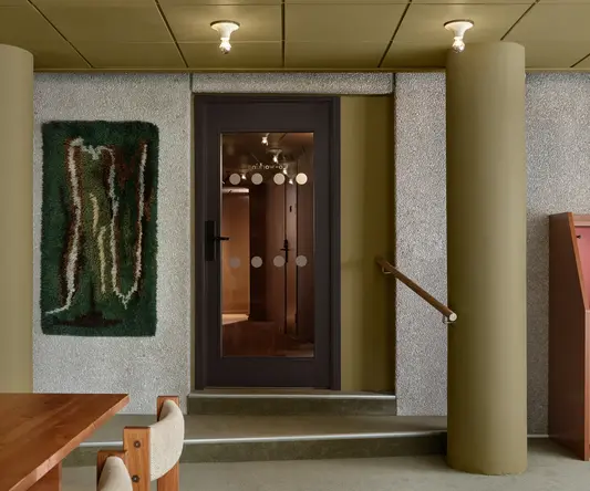 a door with glass panels and a table