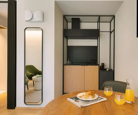 a table with a plate of food and glasses on it