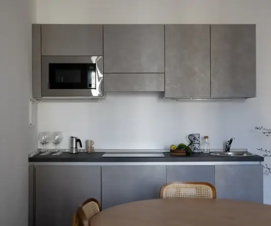 a kitchen with a table and chairs