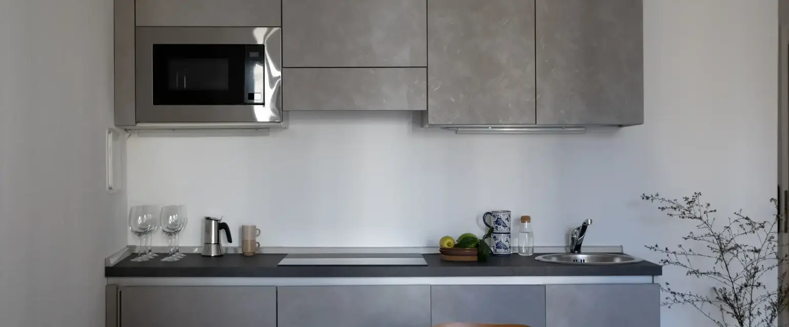 a kitchen with a table and chairs