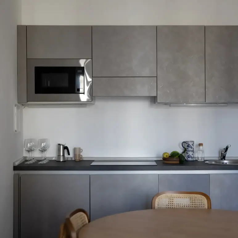 a kitchen with a table and chairs