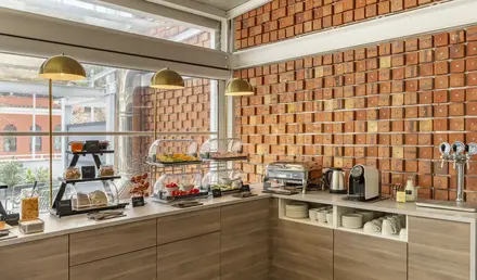 a kitchen with a counter and a coffee machine