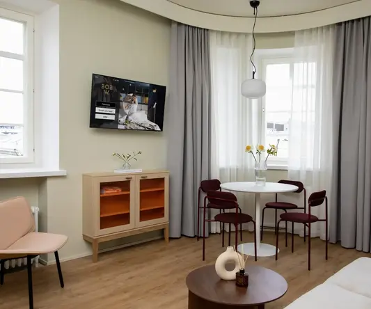 a room with a table and chairs