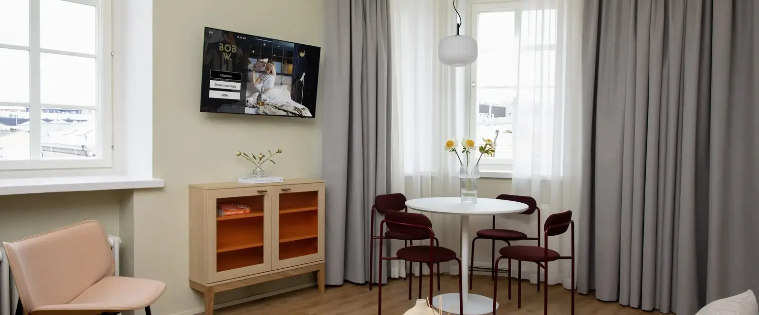 a room with a table and chairs