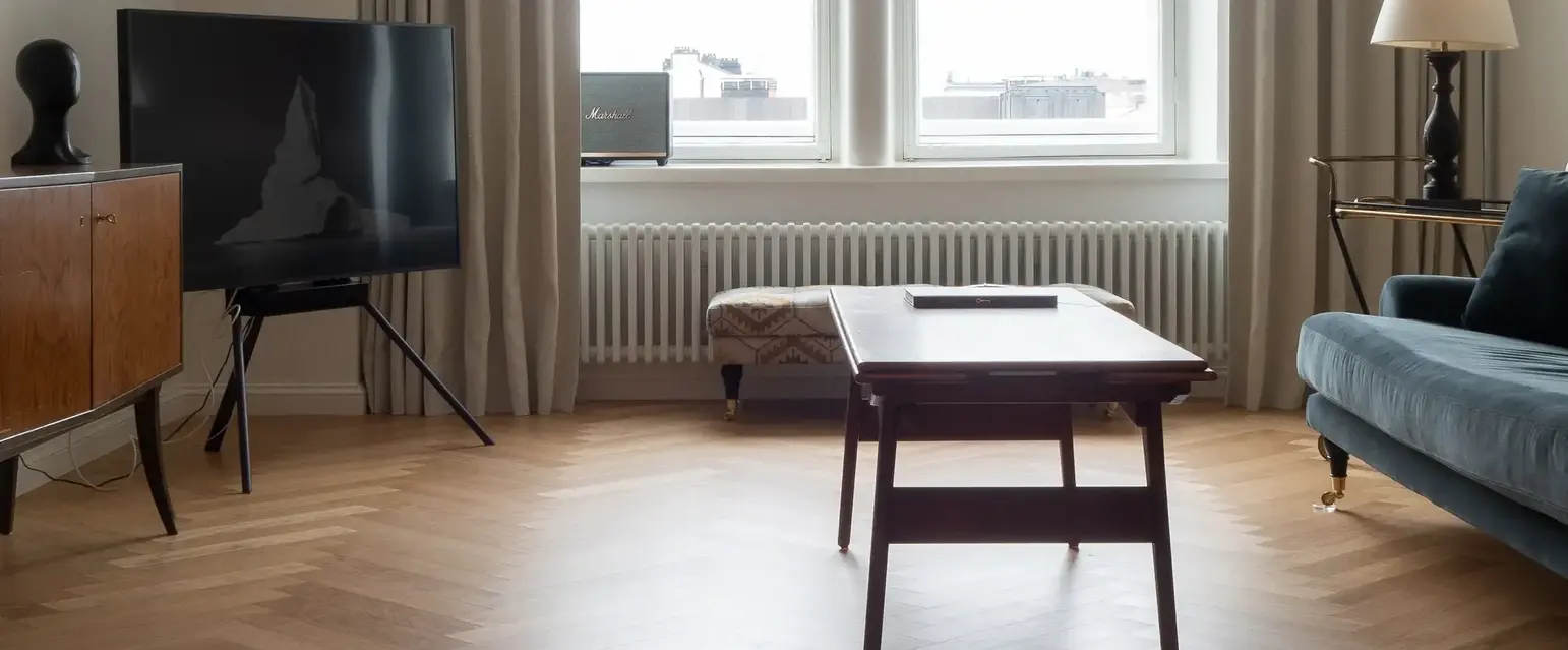 a living room with a couch and a tv