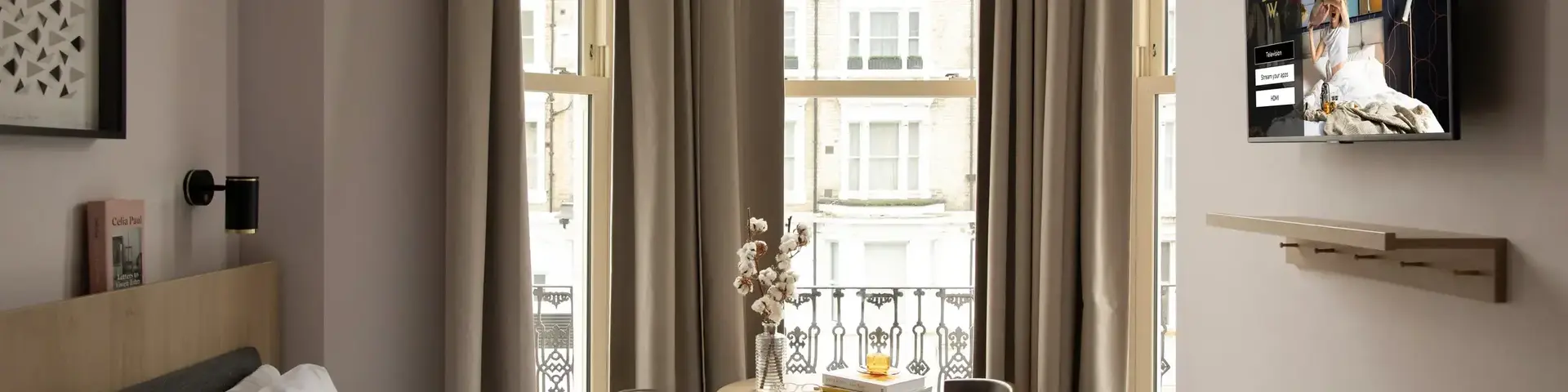 a bedroom with a bed and a table