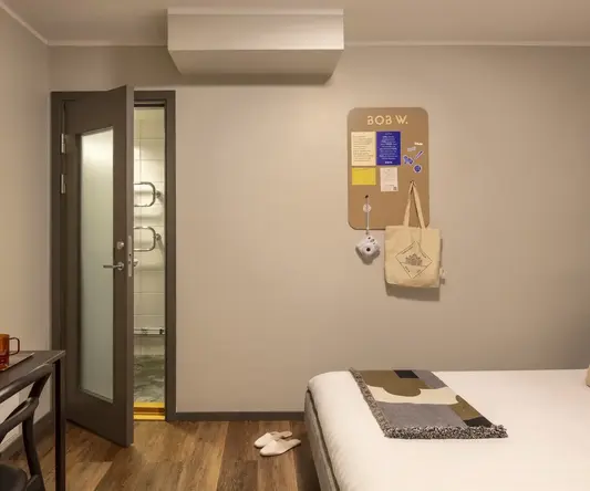 a bedroom with a door and a bed