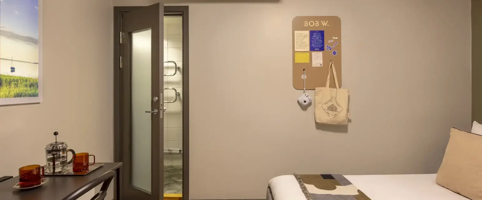 a bedroom with a door and a bed
