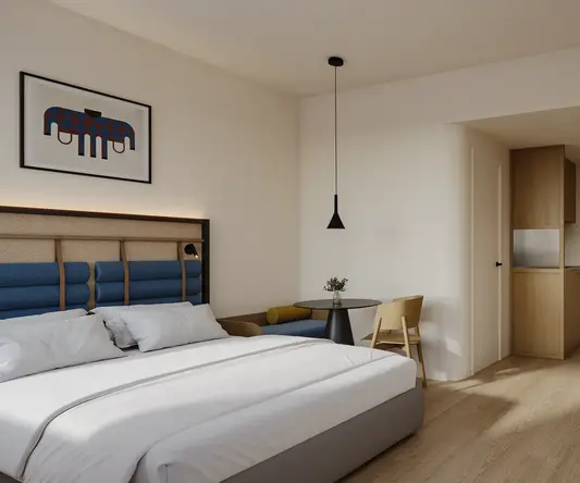a bedroom with a bed and a table