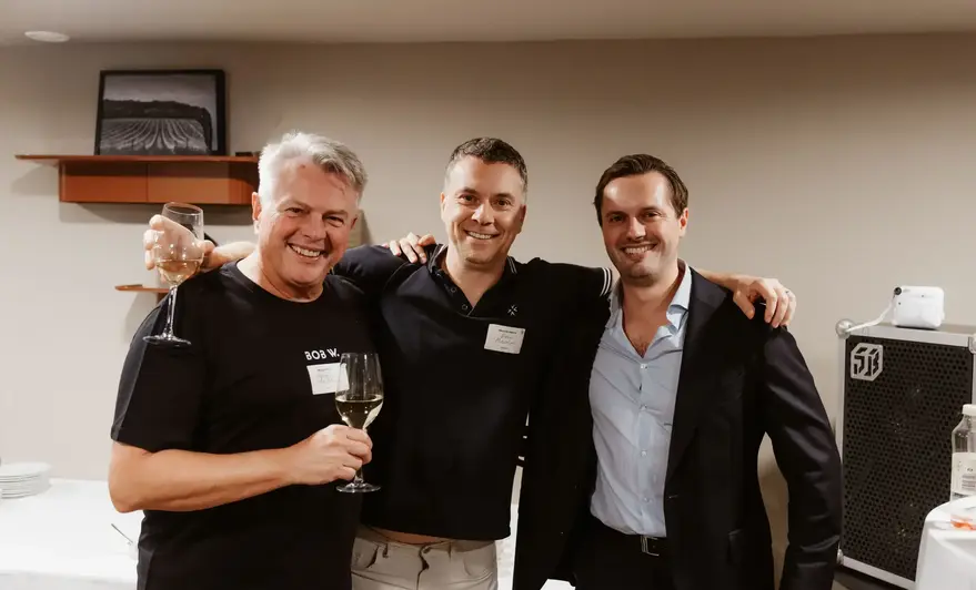a group of men posing for a photo