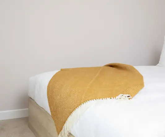 a bed with a blanket on it