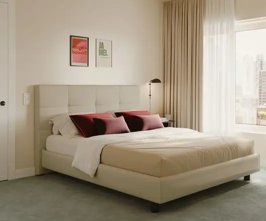 a bed with a lamp and a window