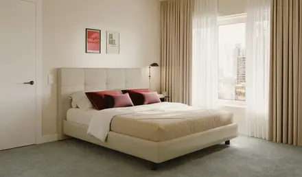 a bed with a lamp and a window