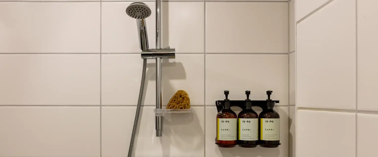 a shower head with soap and soaps