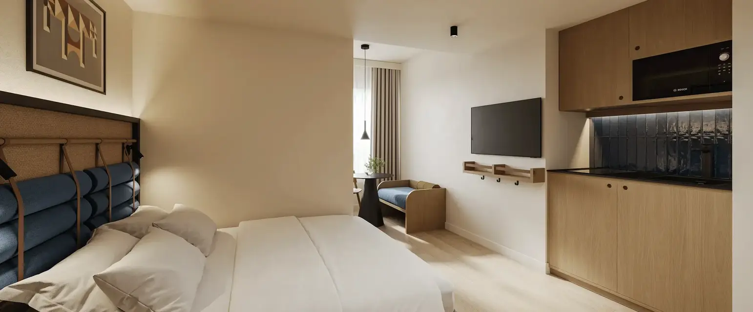 a bedroom with a bed and a tv