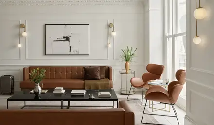 a living room with a couch and chairs