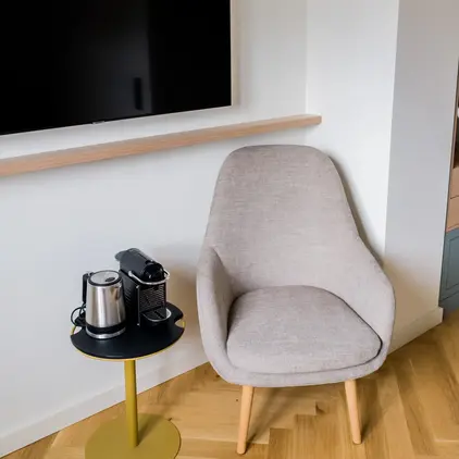 a chair and coffee cups on a table