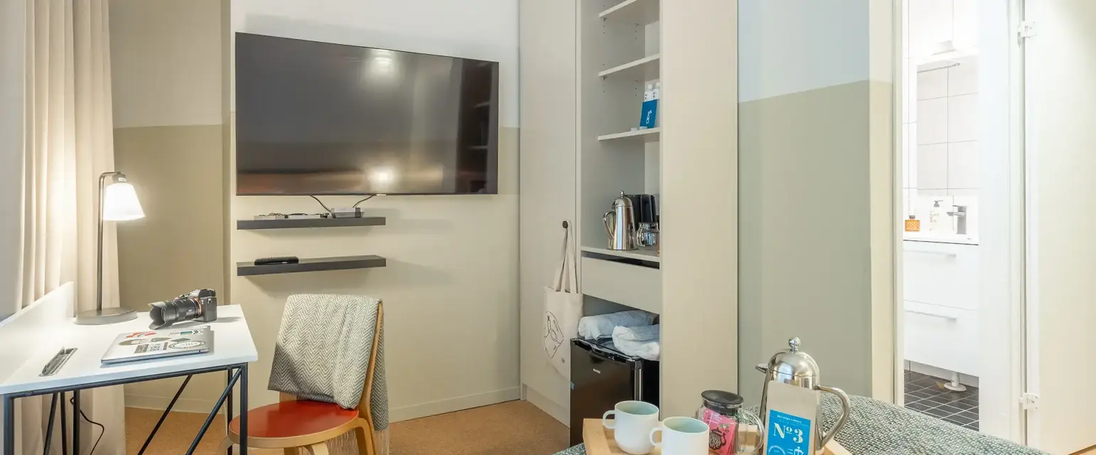 a room with a tv and a bed