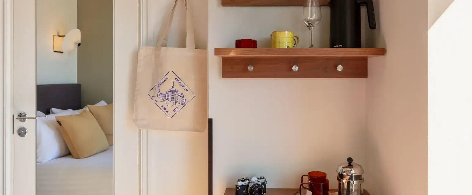 a coffee maker and coffee pot on a shelf