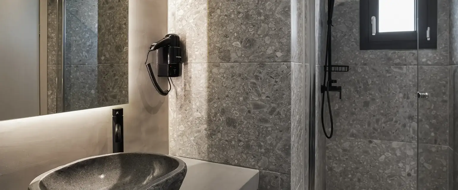 a bathroom with a sink and shower