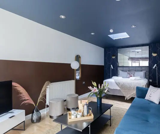 a room with a bed and a tv
