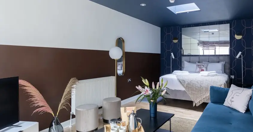 a room with a bed and a tv