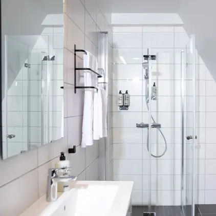 a bathroom with a shower and sink