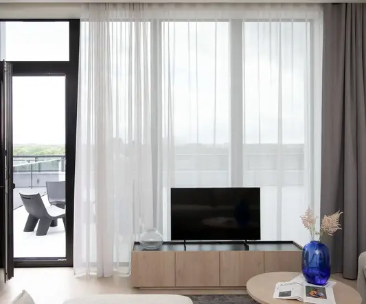 a room with a television and a table