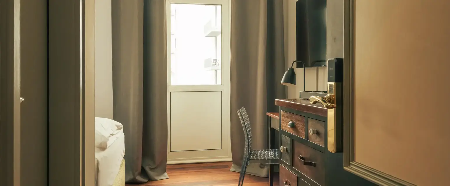 a room with a dresser and a chair